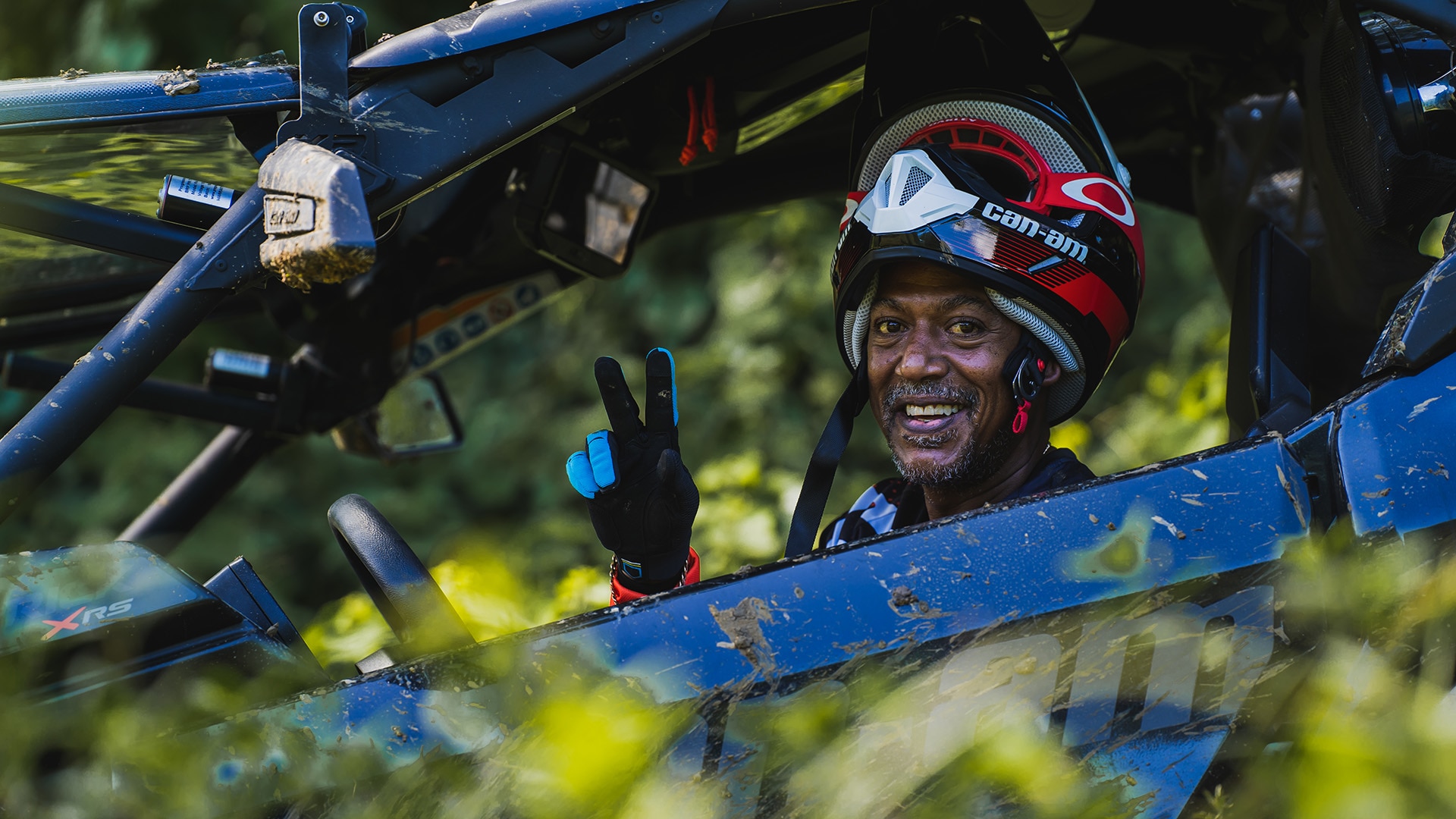 Rider sitting in his Can-Am side-by-side vehicle